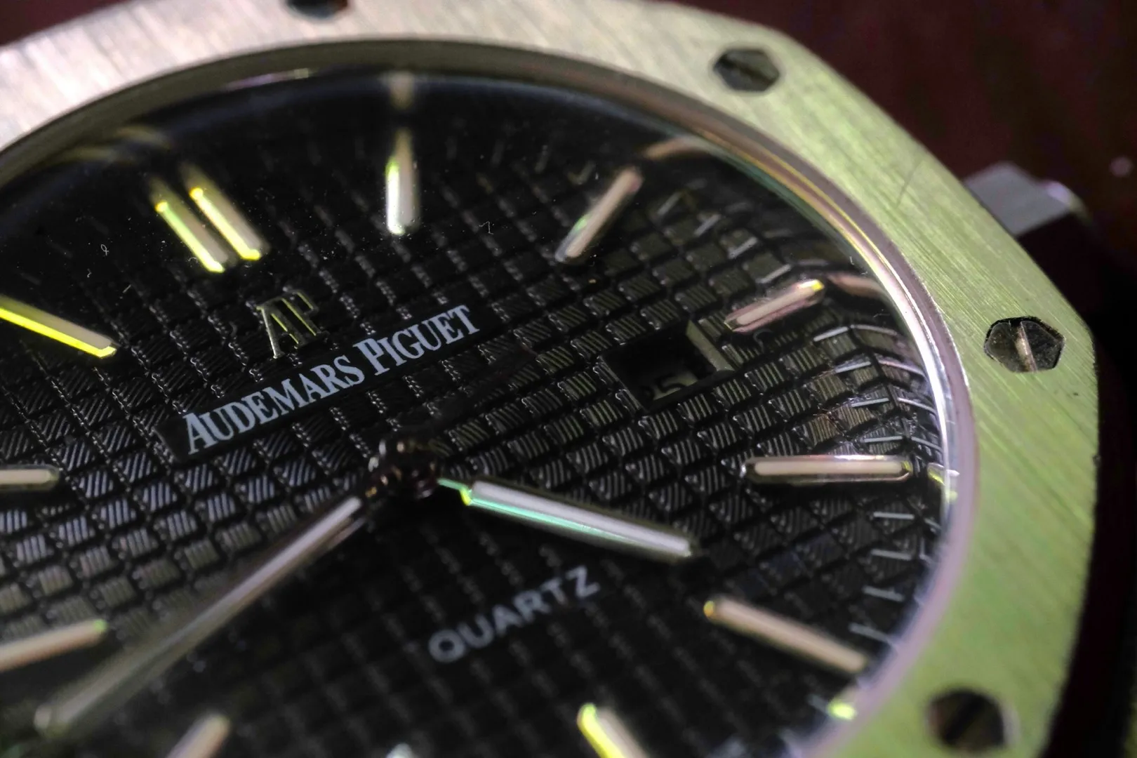 Close-up of an Audemars Piguet Royal Oak dial showing the iconic Grande Tapisserie pattern and AP logo