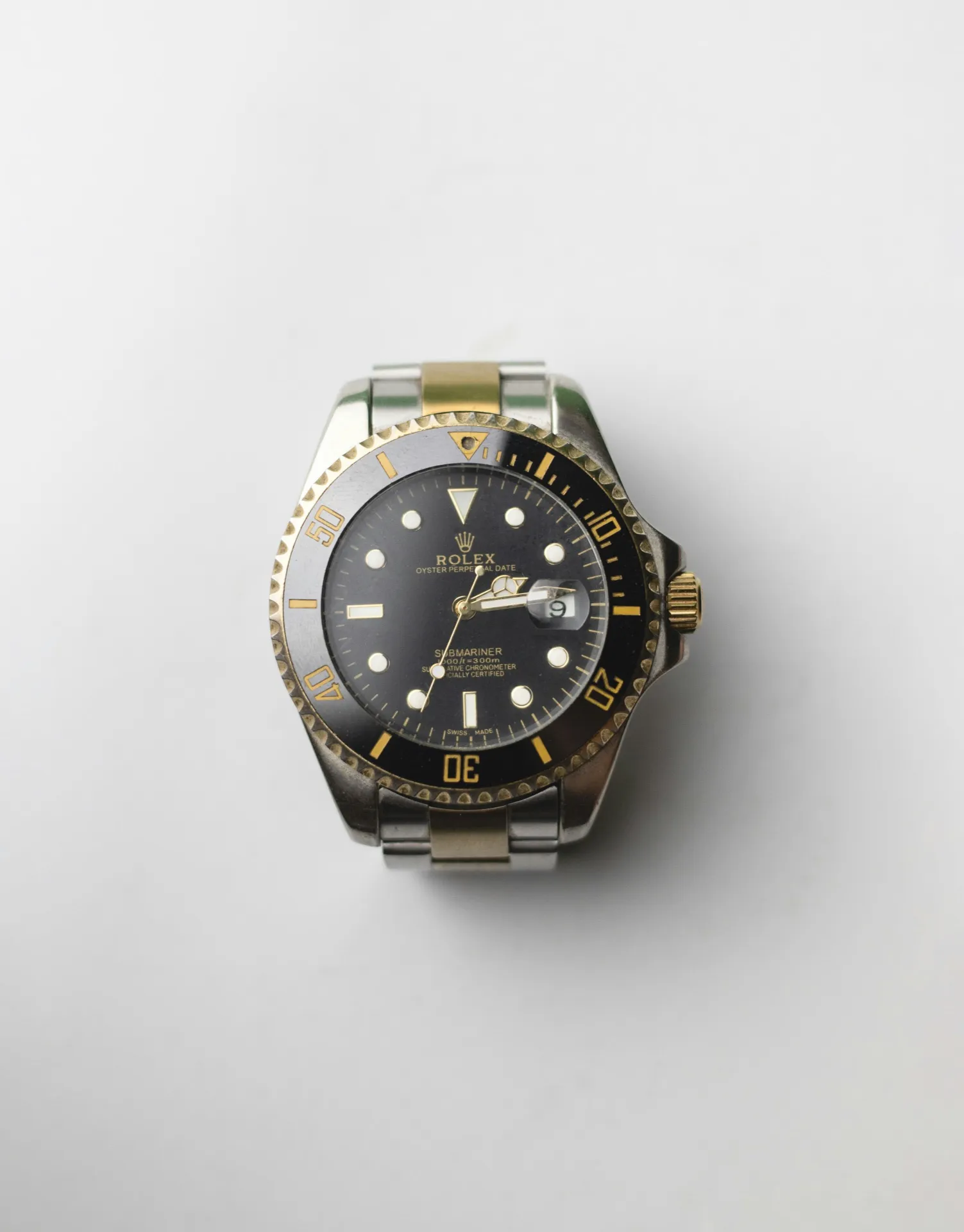 Two-tone Rolex Submariner with black dial — a reference that commands premium prices on the secondary market